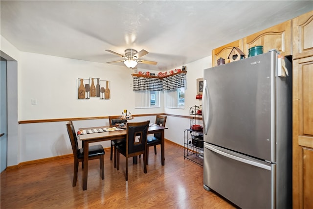 dining space featuring hardwood / wood-style flooring and ceiling fan