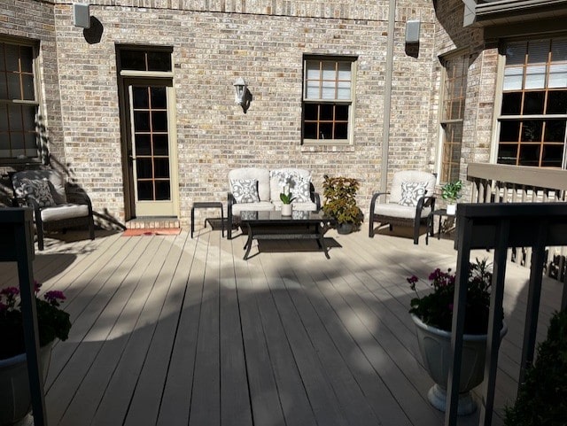 wooden deck featuring an outdoor living space