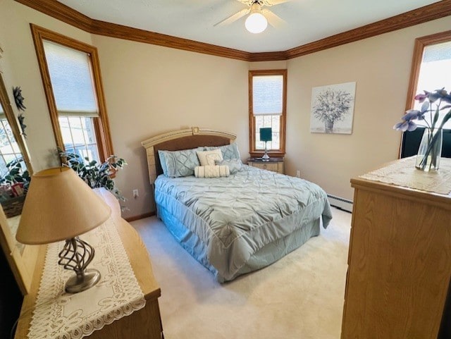 bedroom featuring light colored carpet, baseboard heating, ornamental molding, and ceiling fan