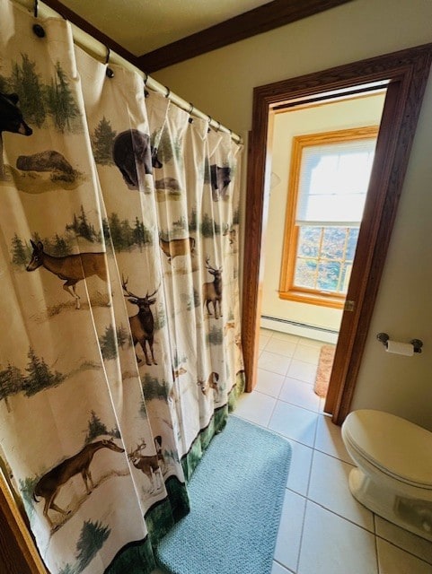 bathroom featuring tile patterned floors, a baseboard radiator, and toilet