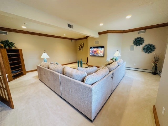 carpeted living room featuring ornamental molding and a baseboard heating unit