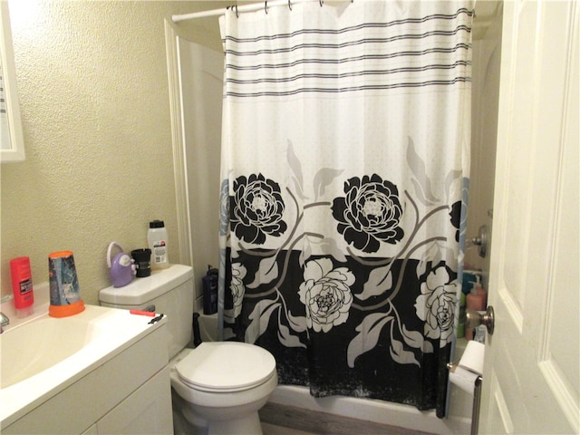 bathroom with toilet, a shower with curtain, and vanity