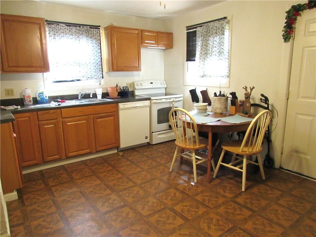 kitchen with sink and white appliances