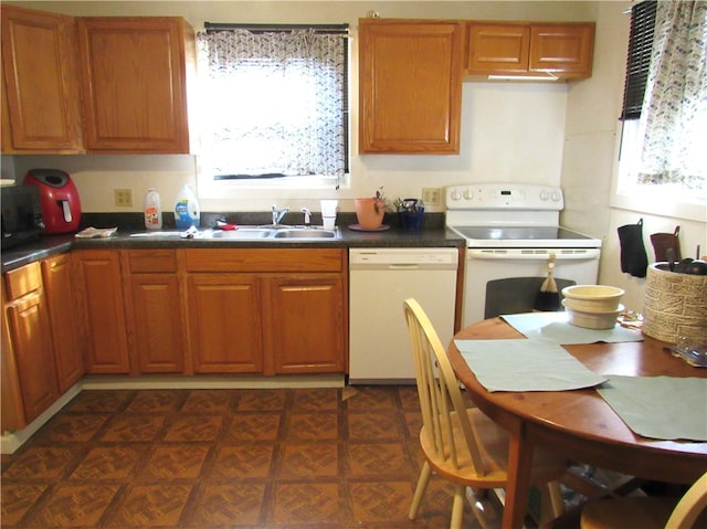 kitchen with sink and white appliances