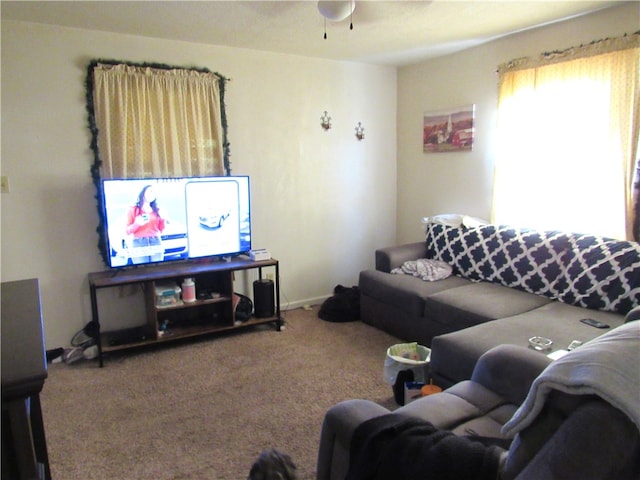 carpeted living room featuring ceiling fan