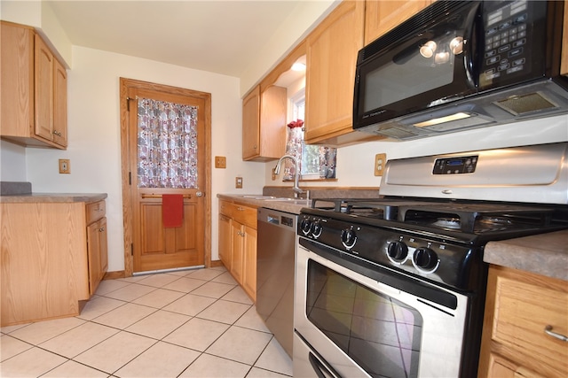 kitchen with light tile patterned flooring, sink, light brown cabinets, gas range, and stainless steel dishwasher