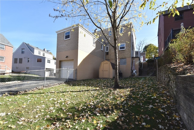 view of property exterior with a garage, a yard, and a shed