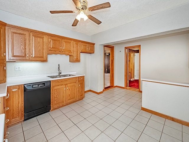 kitchen featuring black dishwasher, sink, light tile patterned flooring, a textured ceiling, and ceiling fan