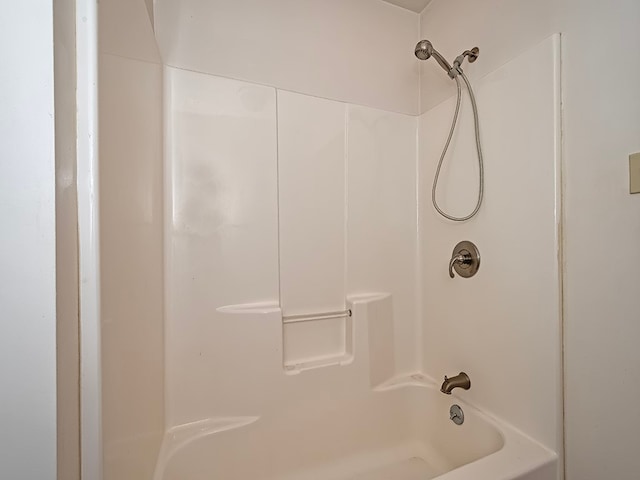 bathroom with washtub / shower combination