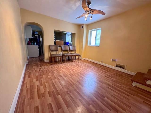 sitting room featuring hardwood / wood-style flooring and ceiling fan