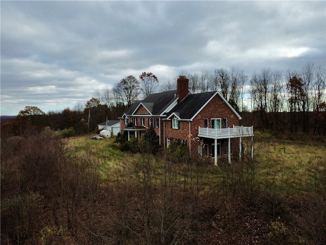 back of property with a balcony