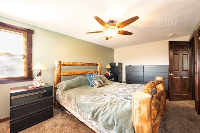 bedroom with vaulted ceiling, carpet floors, and ceiling fan