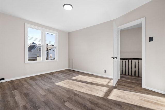 empty room with hardwood / wood-style floors