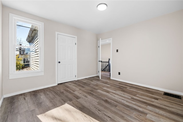 empty room featuring dark hardwood / wood-style floors