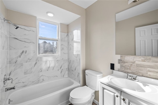 full bathroom featuring vanity, toilet, and tiled shower / bath