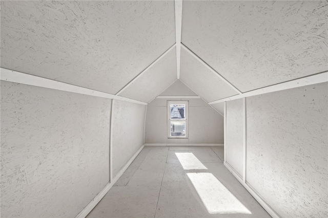 bonus room featuring lofted ceiling