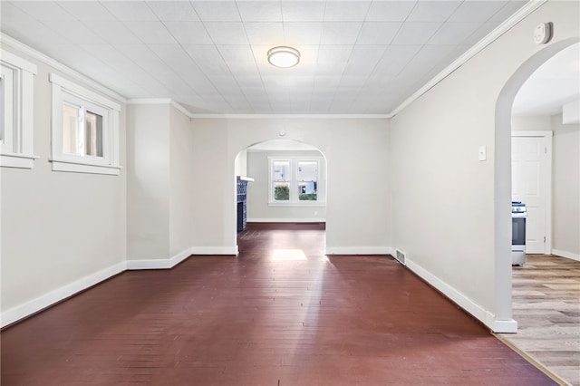 interior space featuring ornamental molding and dark hardwood / wood-style floors