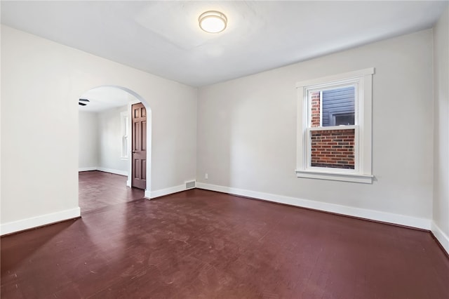 unfurnished room featuring dark hardwood / wood-style flooring