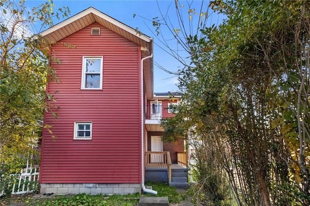 view of home's exterior featuring a balcony