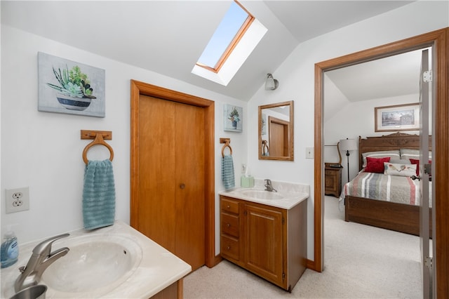 bathroom with vanity and vaulted ceiling