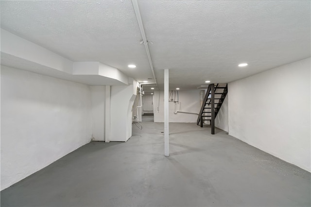 basement with a textured ceiling