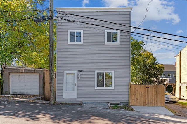 front of property with an outbuilding and a garage