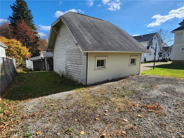 view of side of home featuring a yard