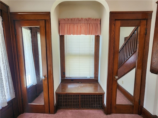 entryway with light carpet and french doors