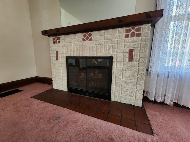 room details with carpet and a fireplace