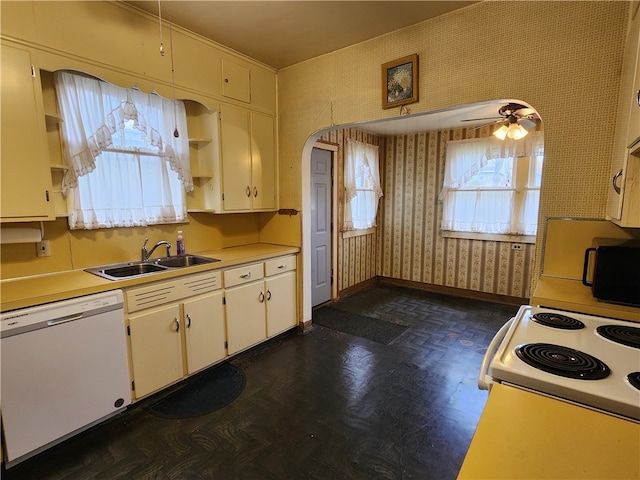 kitchen featuring sink, white appliances, and ceiling fan