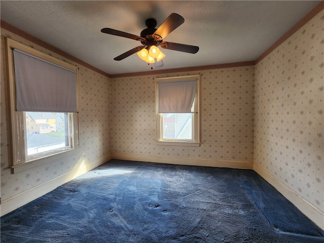 unfurnished room with crown molding, a textured ceiling, carpet, and ceiling fan