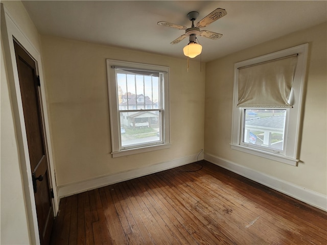 spare room with ceiling fan and hardwood / wood-style floors