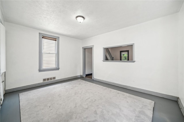 empty room with a textured ceiling