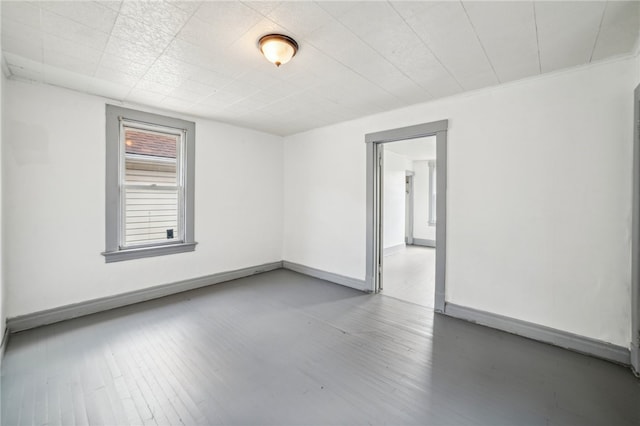 spare room featuring hardwood / wood-style floors