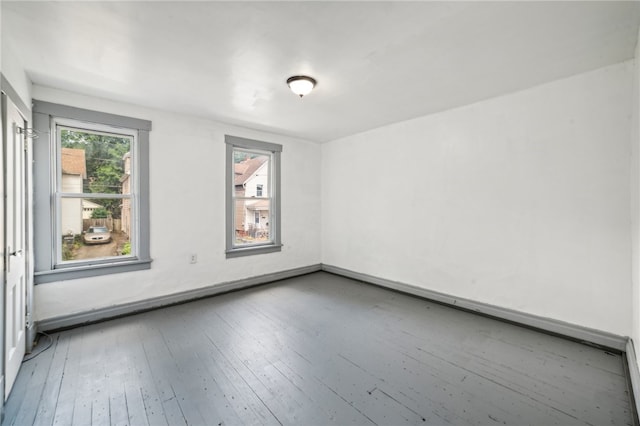 spare room with wood-type flooring