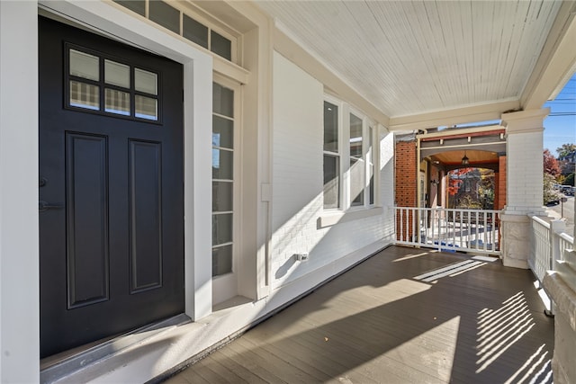 property entrance with covered porch