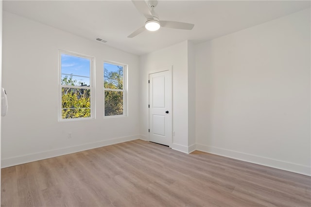 unfurnished room featuring ceiling fan and light wood-type flooring