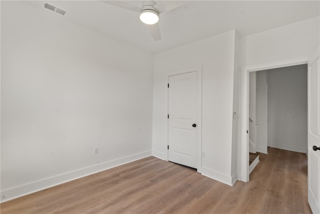 unfurnished bedroom featuring ceiling fan and light hardwood / wood-style floors