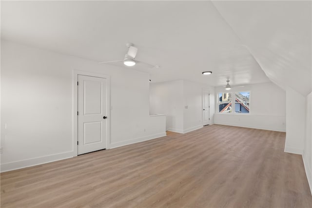 additional living space featuring lofted ceiling, light hardwood / wood-style flooring, and ceiling fan