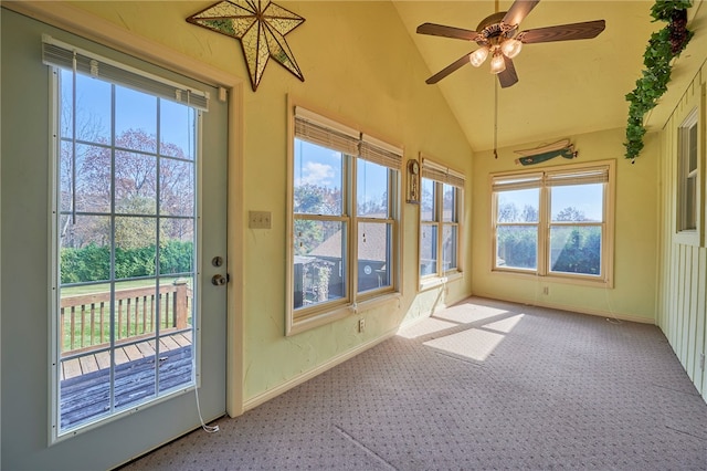 unfurnished sunroom featuring lofted ceiling and ceiling fan