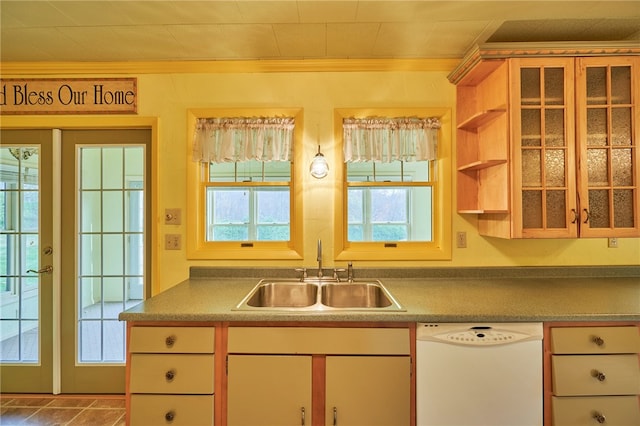 kitchen featuring a wealth of natural light, sink, dishwasher, and tile patterned flooring