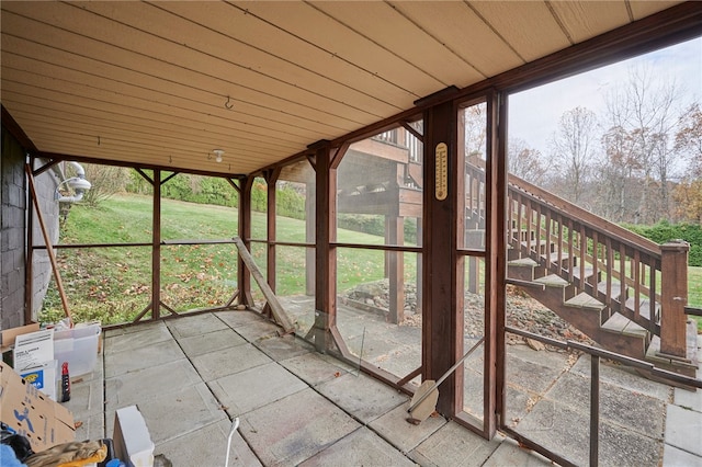 unfurnished sunroom featuring wooden ceiling