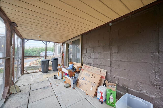 unfurnished sunroom with wood ceiling