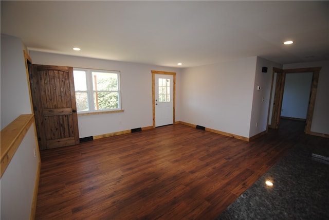 empty room with dark wood-type flooring