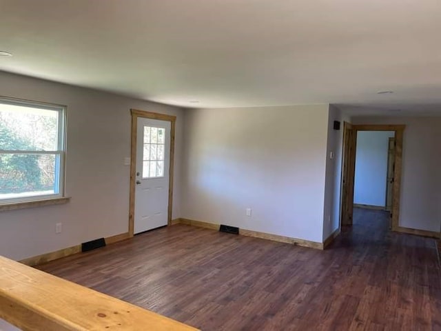 entryway with dark wood-type flooring