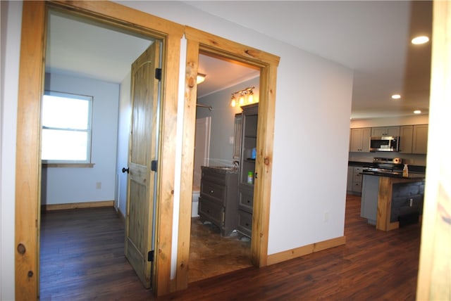 hallway with dark hardwood / wood-style floors