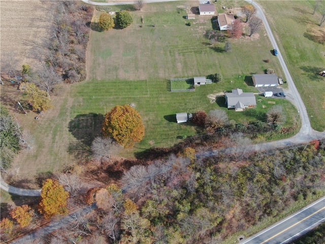 birds eye view of property with a rural view