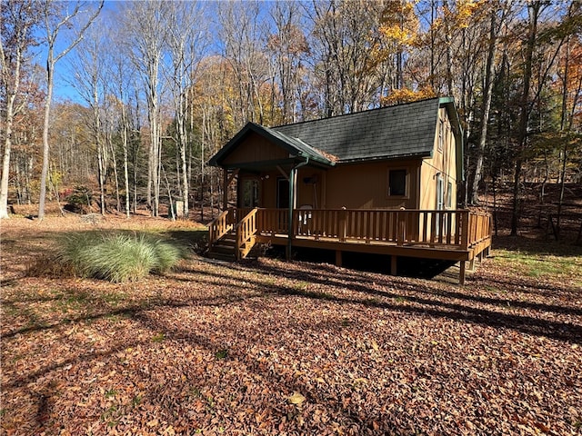 view of front facade with a wooden deck