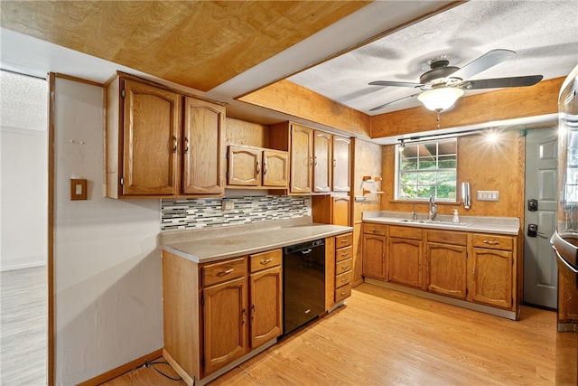 kitchen with dishwasher, sink, ceiling fan, light wood-type flooring, and tasteful backsplash