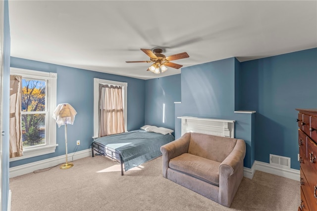 bedroom with ceiling fan and carpet flooring